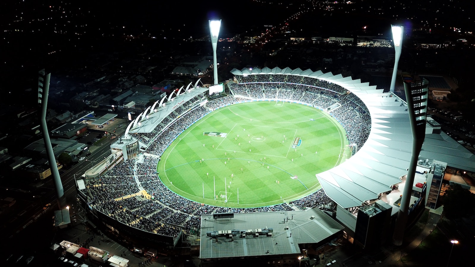 high-angle photo of round stadium at nighttime AFL